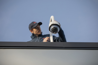 Electronic Security technician working on a PTZ CCTV camera - Securitas UK.jpg